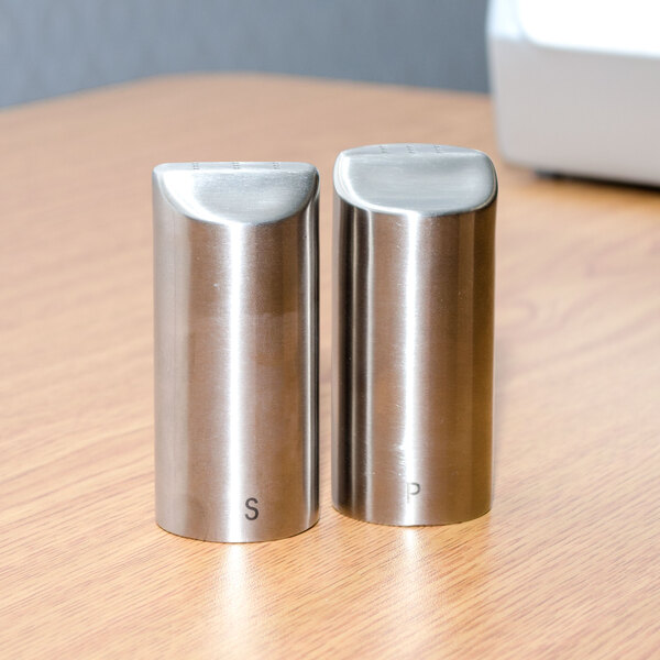 A Tablecraft Marina stainless steel salt and pepper shaker set on a table.