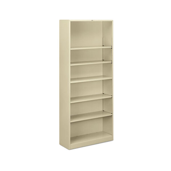 A putty metal bookcase with six shelves.
