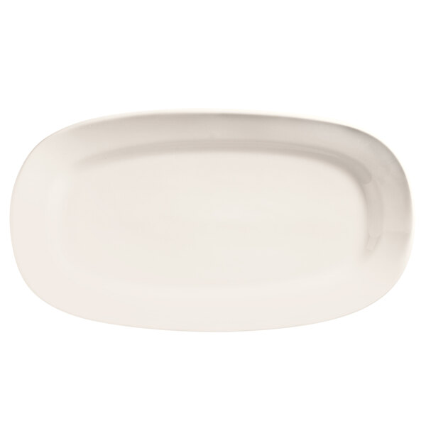 A white oval porcelain racetrack platter with a white rim.