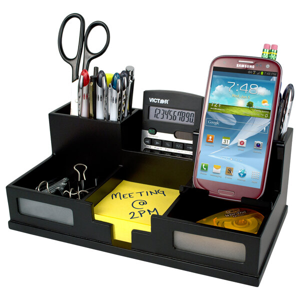 A black Victor wood desktop organizer with 6 sections holding a cell phone and office supplies.
