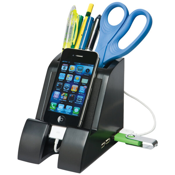 A black Victor Smart Charge pencil cup holding a cell phone and stationery with a pair of scissors inside.