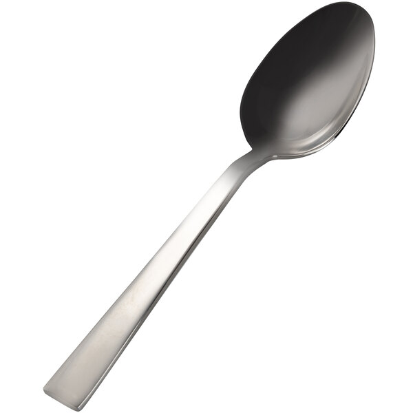 A close-up of a Bon Chef Roman stainless steel serving spoon with a white handle.