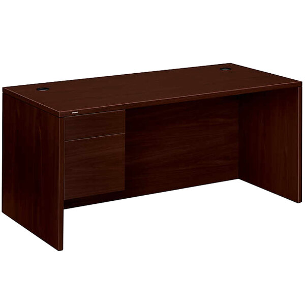 A mahogany HON pedestal desk with a drawer.
