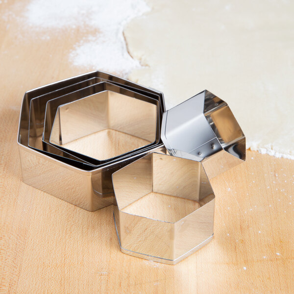 Ateco stainless steel hexagon cutter set on a table.