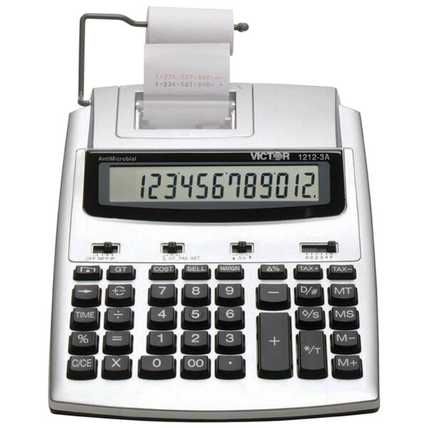 A Victor two-color printing calculator with a receipt on top.
