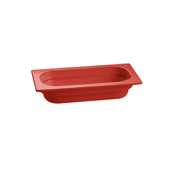 A red rectangular Tablecraft cast aluminum food pan with rectangle edges.