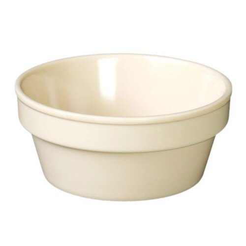 A tan melamine sauce cup with a white background.