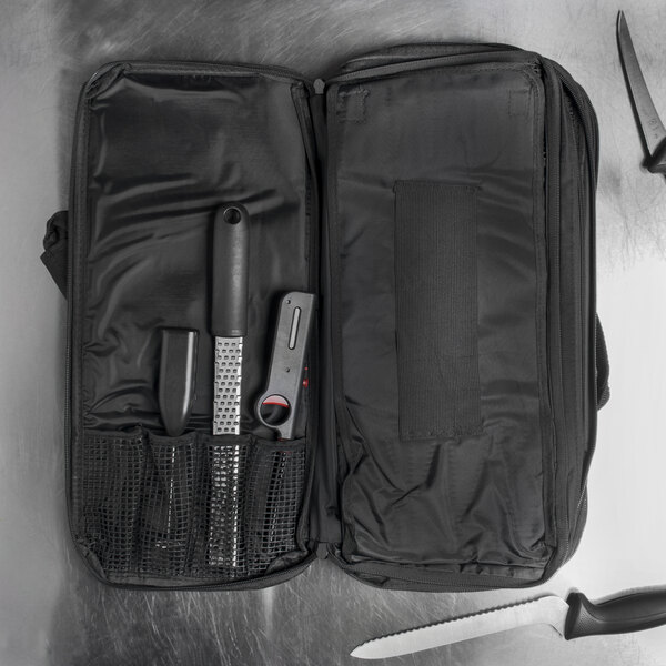 A Dexter-Russell black cutlery case with tools inside.