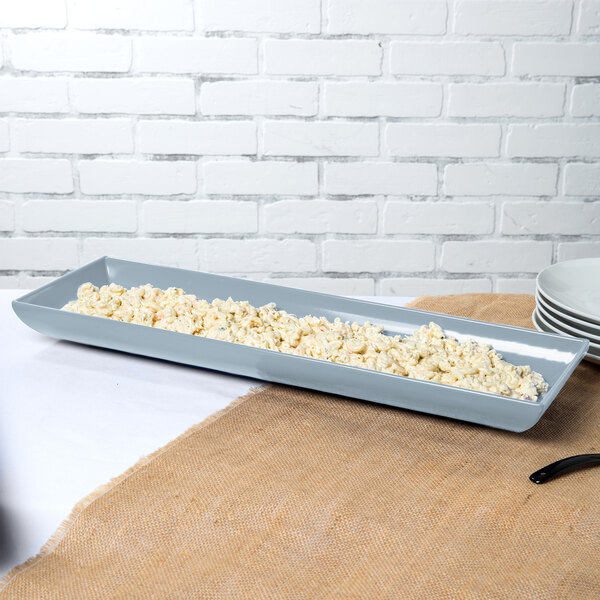 A Tablecraft gray rectangular cast aluminum tray of macaroni and cheese on a table.
