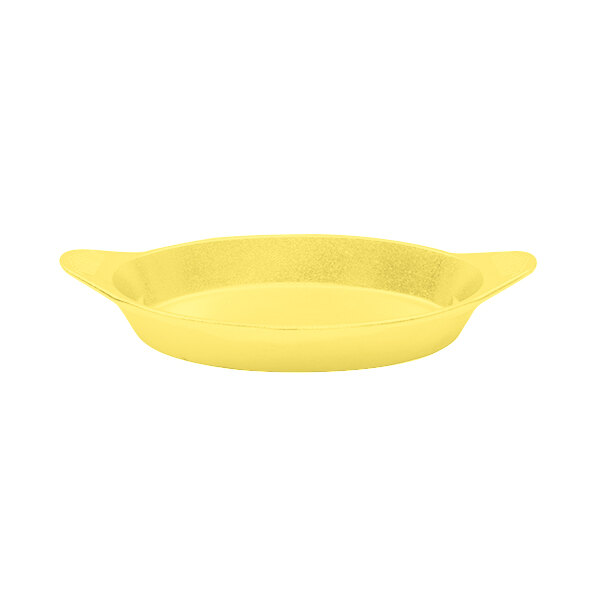 A yellow cast aluminum pan with shell handles.