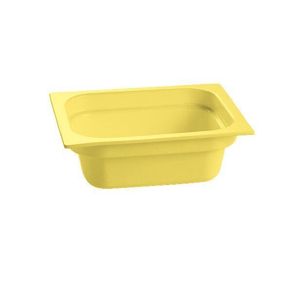 A yellow rectangular cast aluminum food pan.