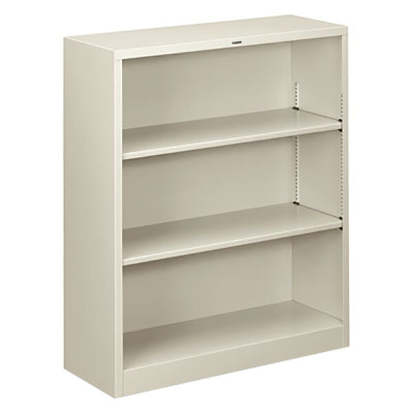 A light gray HON metal bookcase with three shelves.