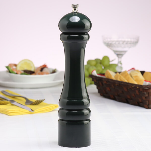 A Chef Specialties Forest Green Pepper Mill on a table.