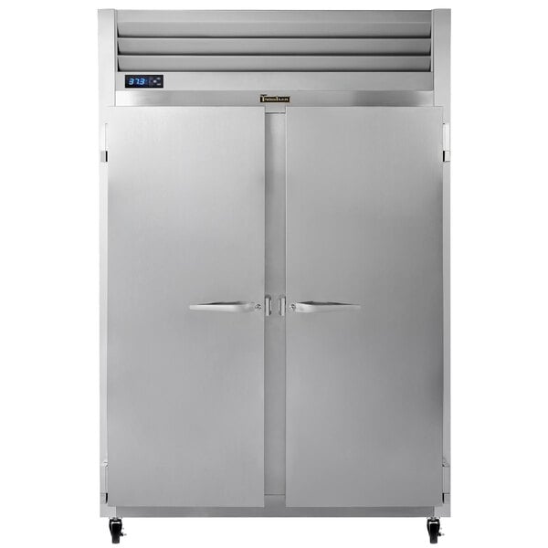 A large silver Traulsen G Series reach-in refrigerator with two solid doors, each with a metal handle.