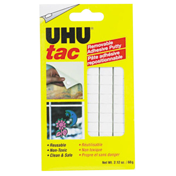 A yellow and grey package of UHU Tac adhesive putty.