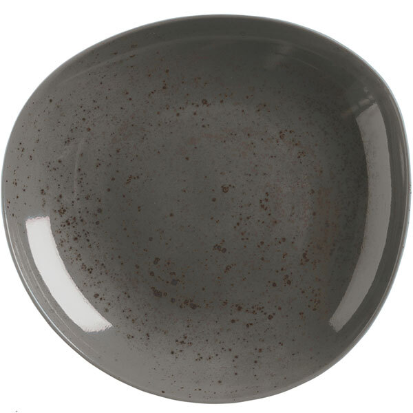 A close-up of a dark gray Schonwald porcelain bowl with speckled white and grey surfaces.