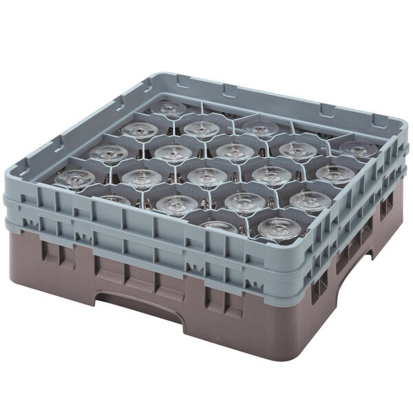 A brown plastic Cambro glass rack with clear glass cups inside.