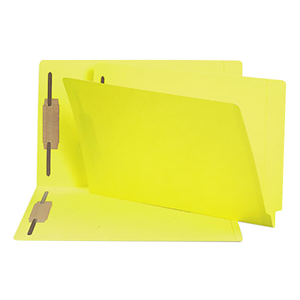 A yellow Smead Shelf-Master legal size file folder with metal fasteners.