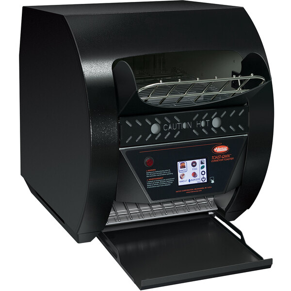 A black rectangular Hatco conveyor toaster with a lid open and digital controls.