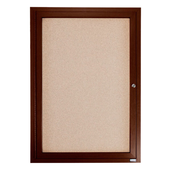 A brown enclosed bulletin board with a walnut finish.