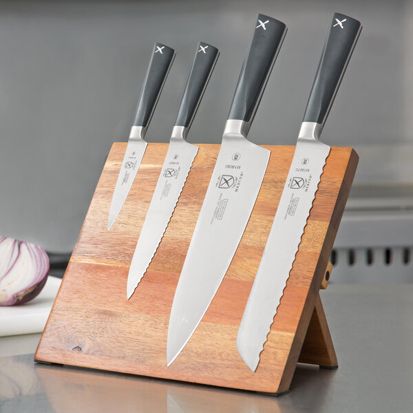 A set of Mercer Culinary Z&#252;M knives on a wooden board