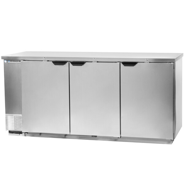 A stainless steel Beverage-Air back bar refrigerator with three solid doors.