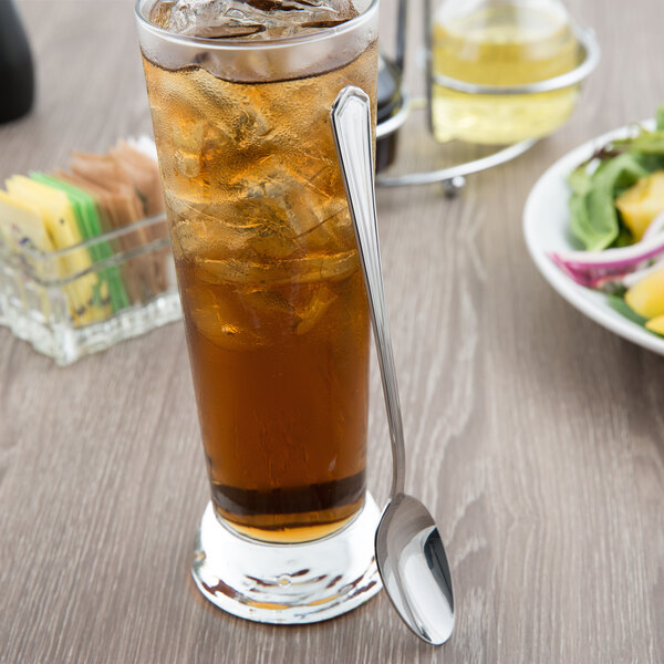 A glass of iced tea with a Libbey stainless steel iced tea spoon.