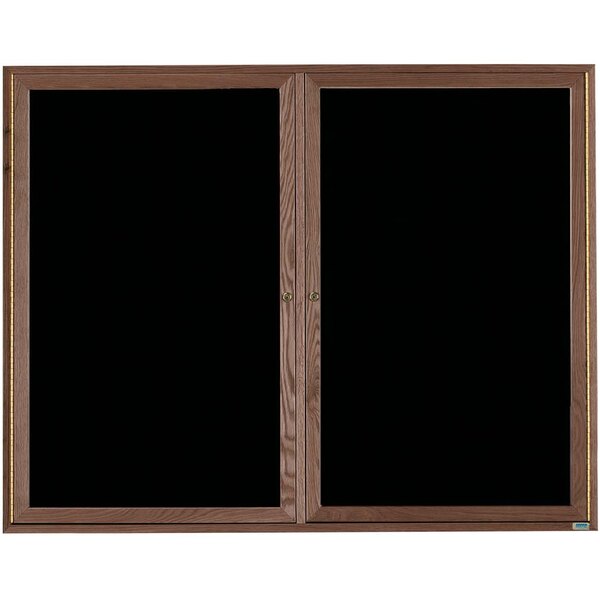 A black board with walnut framed doors.