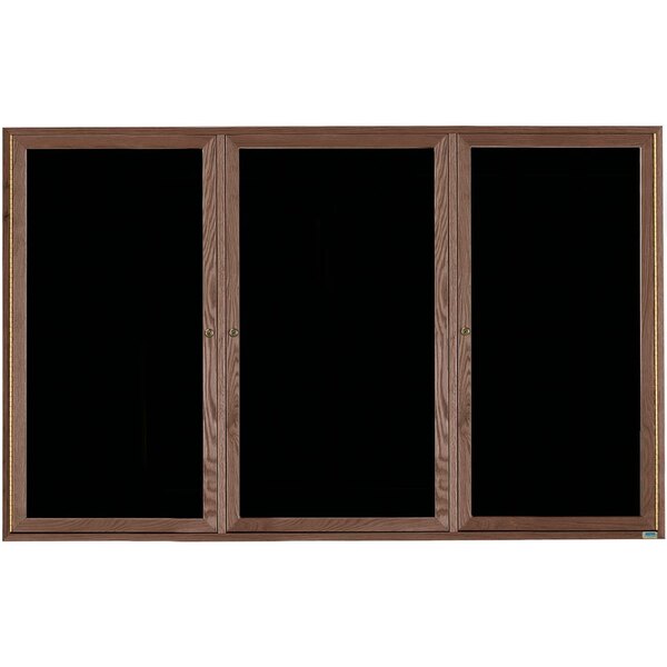A black felt message board with wooden doors.