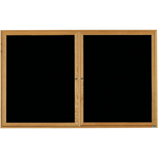 A black board with a natural oak frame and black glass doors.
