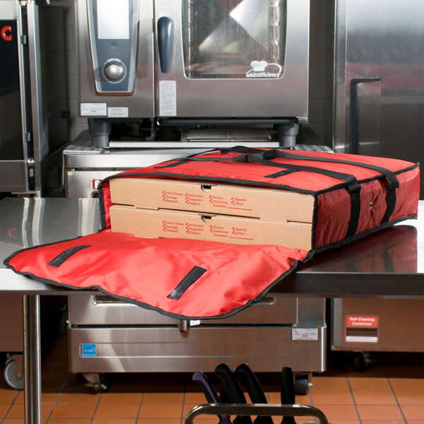 An American Metalcraft red nylon pizza delivery bag with stacked pizza boxes inside.