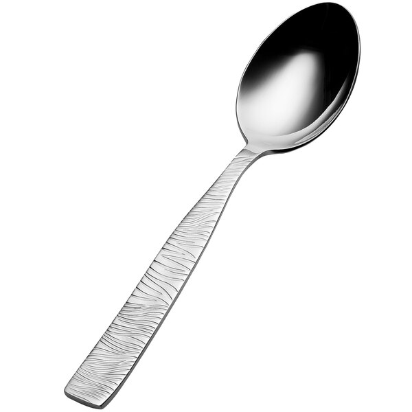 A close-up of a Bon Chef stainless steel soup/dessert spoon with a black handle.