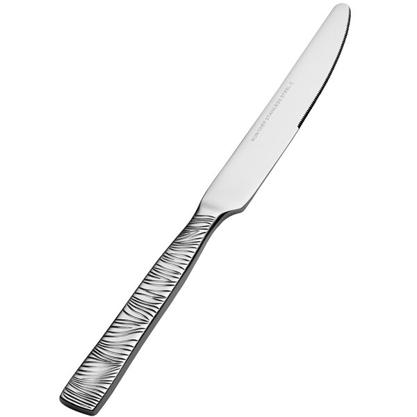 A Bon Chef European size dinner knife with a textured black and white handle.