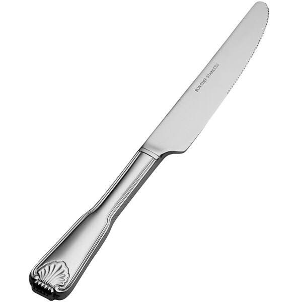 A Bon Chef stainless steel dinner knife with a shell design on the handle.