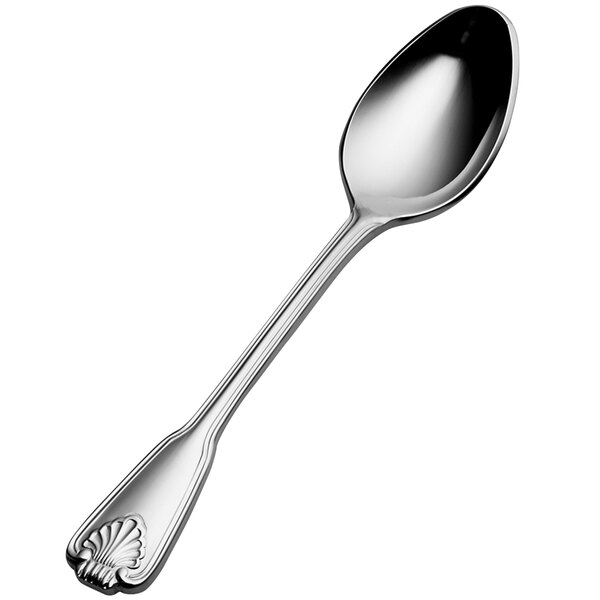 A close-up of a Bon Chef stainless steel demitasse spoon with a shell design on the handle.