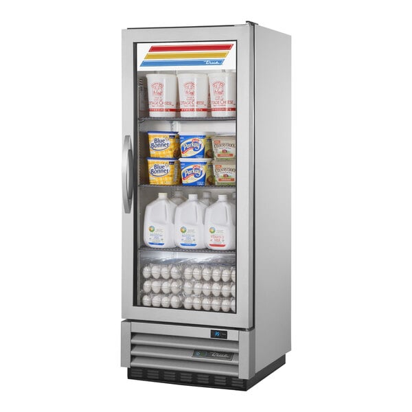 A True reach-in refrigerator with milk and yogurt on the shelves.