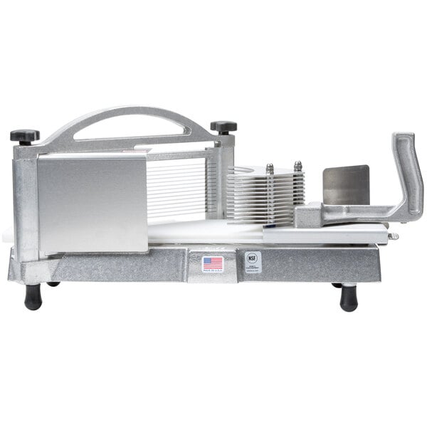 A Nemco Easy Tomato Slicer II with a piece of food in it.