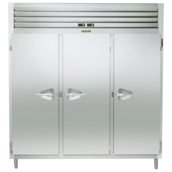 A Traulsen stainless steel narrow reach in refrigerator and freezer with three doors.