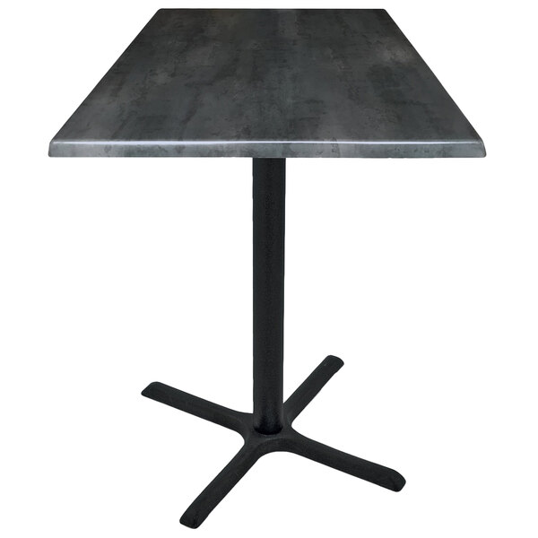 A Holland Bar Stool black steel table with a black metal square top on a cross base.