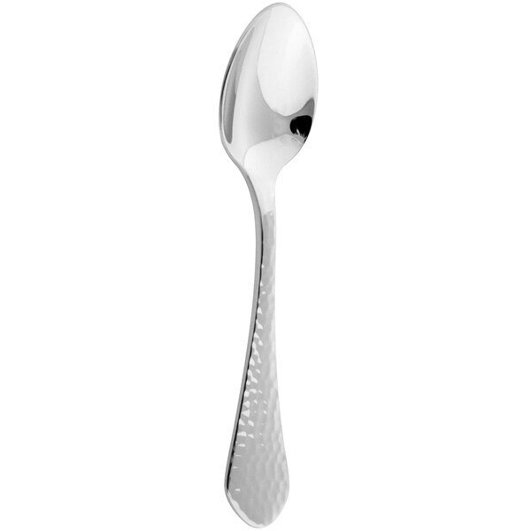 An Arcoroc stainless steel demitasse spoon with a white background.