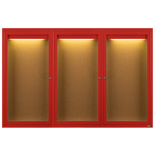 A red Aarco bulletin board cabinet with 3 glass doors and lights.