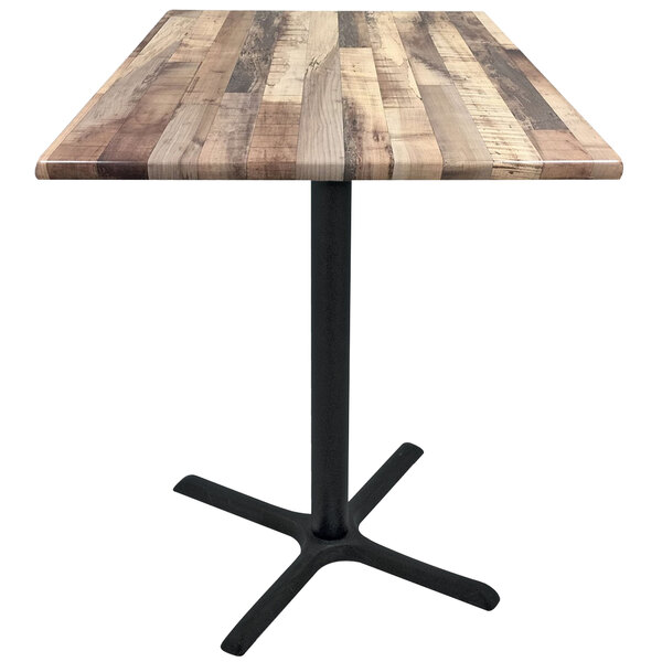 A Holland Bar Stool rustic wood laminate table top with a black cross base.