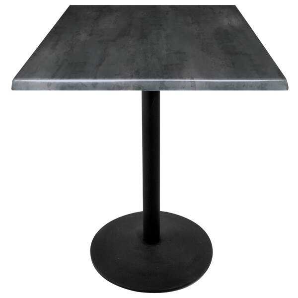 A Holland Bar Stool black steel laminate table with a black round base.
