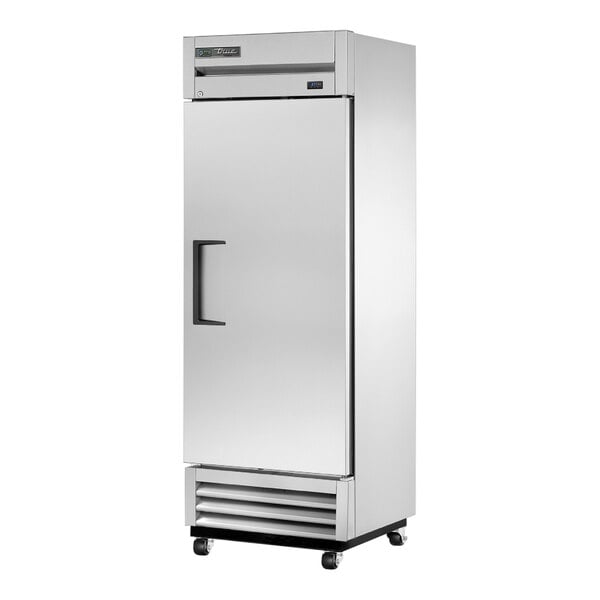 A white True reach-in freezer with black handles.
