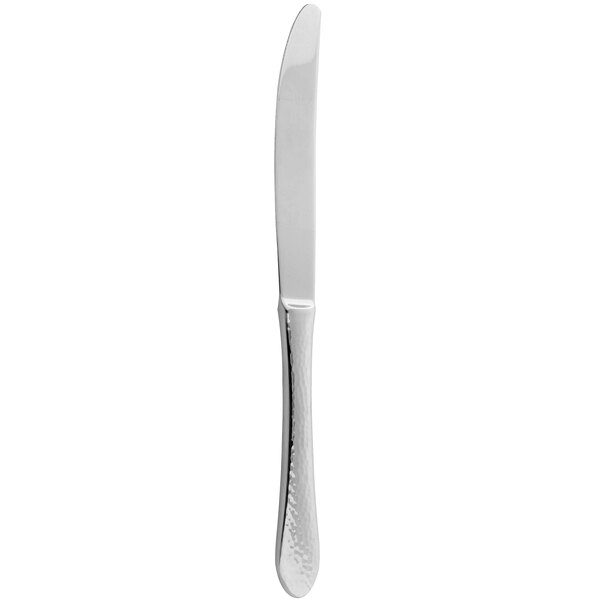 An Arcoroc stainless steel dessert knife with a solid handle.