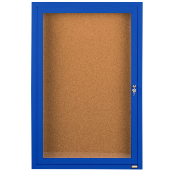 A blue Aarco enclosed bulletin board cabinet with a clear door and key.
