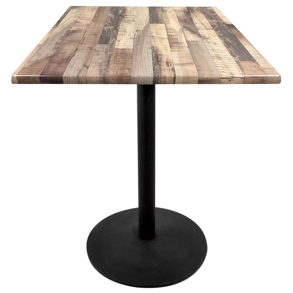 A Holland Bar Stool rustic wood laminate table top with a black base.