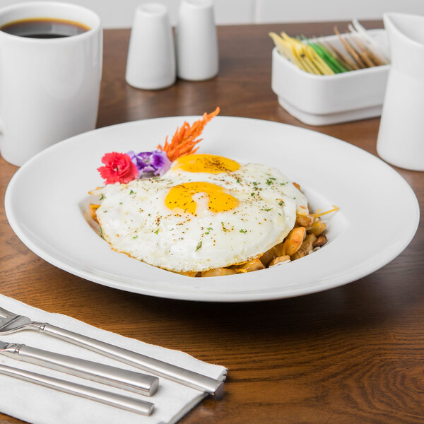 A plate of food with an egg in a Schonwald white rim deep bowl.
