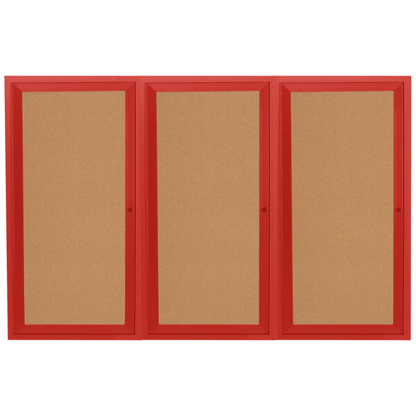 A red bulletin board cabinet with three doors.
