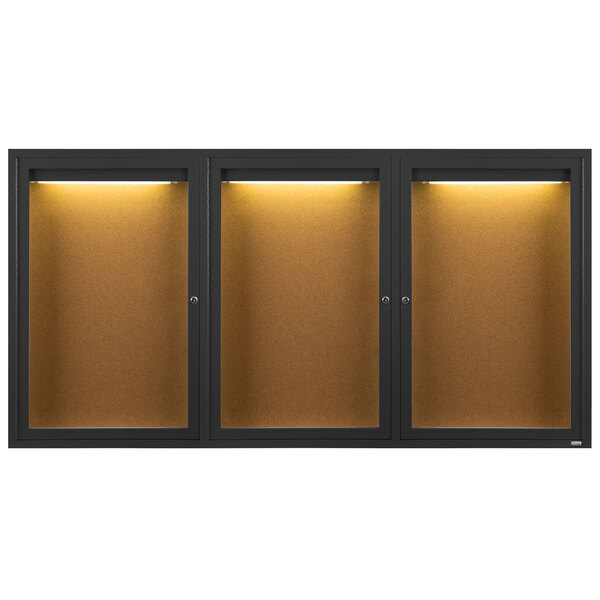 A row of three Aarco black cabinets with lights and glass doors.
